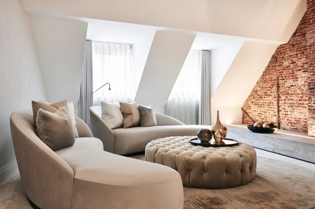 interior design beige couch gold details circle carpet